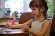 A little girl who draws a felt pen