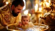 The priest in the church dips the child into the font with holy water, the baptism of the child, the Christian religion and ritual