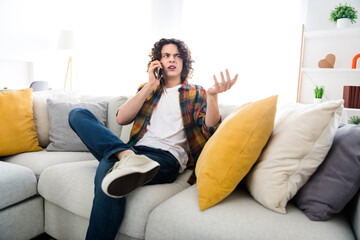 Sticker - Photo of stupor confused guy wear plaid shirt getting fraud call modern device indoors room home house