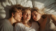 A Triad of Young Polyamorous Sleeping Together. One man and two women
