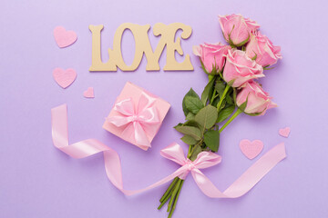 Wall Mural - Pink roses with hearts and gift box on color background, top view. Valentines day concept