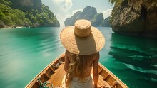 Beautiful Woman Sitting On Long Tail Boat Wearing Straw Hat On Tropical Blue Lagoon. Women At The Tropical Lagoon Beach Of Koh Loa Lading Krabi Thailand Part Of The Koh Hong Islands In Thailand. 