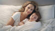 © tinyt.studio - Mother and baby sleep happily on a white sheet bed