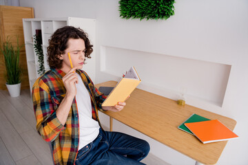 Poster - Photo of doubtful unsure guy dressed checkered shirt thinking plans writing diary indoors house home room