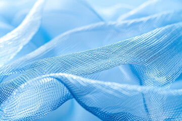 Closeup of abstract fishnet on light blue background.