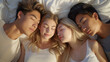Quad in a polyamory relationship sleeping together. 