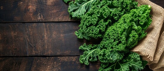 Canvas Print - Healthy diet concept with fresh kale on dark wooden backdrop.