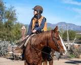 Fototapeta Konie - An elderly woman and her quarter horse in Arizona
