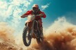 A fearless man defies gravity, soaring through the sky on his dirt bike as he races across rugged terrain, showcasing his expert skills in freestyle motocross