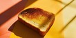 © sergio - A piece of toast on a yellow and orange surface. Generative AI.