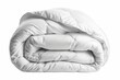 © Maroubra Lab - Soft folded white duvet/blanket, isolated on white background.