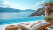 sunset empty sunbed with towels by a pool with an ocean view in Santorini Greece, European summer, infinity pool with chairs