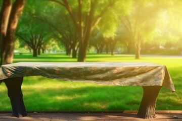 Poster - Empty wood table and defocused bokeh and blur background of garden trees with sunlight. product display template.
