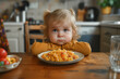 Cute little girl refusing to food at table healthy eating habits concept