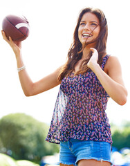 Poster - Smile, sports and woman throwing football outdoor on field for fitness, recreation or fun in summer. Sky, camping and adventure with happy young person playing catch in nature, forest or woods