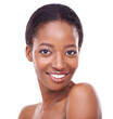 © Marius Venter/peopleimages.com - Closeup, skincare and black woman in white background with smile for glow, beauty and natural look with healthy skin. Happy, smooth and facial wellness for positive results, self care and cosmetics