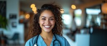 Portrait Of A Young Happy Latina Woman Doctor Smiling Looking At The Camera In A Blue Scrub And Stethoscope.