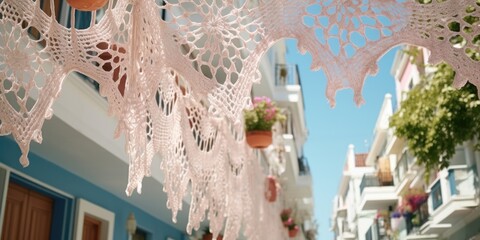 Poster - A row of white crocheted doilies hanging gracefully from a building. Perfect for adding a touch of vintage charm to any space