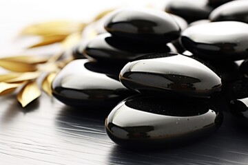 Aufkleber - A collection of black beads placed neatly on a table. Perfect for jewelry making or crafting projects