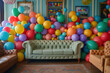 Living room full of colorful balloons by sofa.