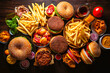 top view of variety of junk food on wooden table