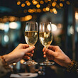 two hands holding glasses of sparkling wine for toasts