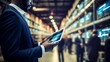 © Ashi - Streamlining warehouse operations: close-up of manager utilizing digital tablet in high-tech facility