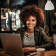 © Ceric Jasmina  - lack african woman smiling with laptop at work in office