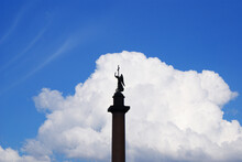 Alexander Column Of The Palace Square, Sculpture Of Anel With A Cross Against The Sky, Historical Sculptures. Saint Petersburg.