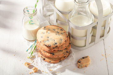 Wall Mural - Tasty and sweet vanilla cookies served with milk in bottle.