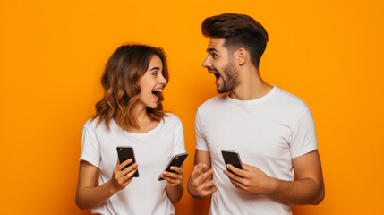 Poster - young man and woman are both holding smartphones and smiling at each other, with a bright orange background