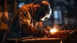 © Ilmi - welder is welding metal , industry sparkle background. welder at work. welding machine to weld steel at factory