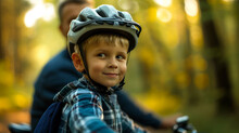 A Boy With A Bicycle Helmet Together With His Father