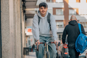 Poster - student on the street riding a vintage bicycle