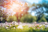 Fototapeta Natura - Spring petals on branches in picturesque rural landscape. Blur style.