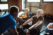 © Davor - Group of senior people working out with trainer in gym