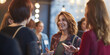 © RemsH - meeting within a company, networking at a reception, group of employees, businesswomen chatting at a networking event, sharing and chatting with a smile