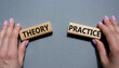Theory or Practice symbol. Concept word Theory or Practice on wooden blocks. Businessman hand. Beautiful grey background. Business and Theory or Practice concept. Copy space