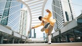 Fototapeta  - Stylish asian man perform hiphop dancing with low angle camera. Break dancer walking up the stair while listening music from headphone and dancing together at city. Outdoor sport 2024. Sprightly.