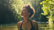 © Elena - Lifestyle portrait of attractive young black woman outside enjoying a swim in forest stream in summer sunlight