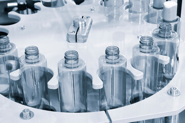 Poster - pharmaceutical industry, medicine pills are filling in the  bottle on production line machine conveyor at the medical factory. selective focus.