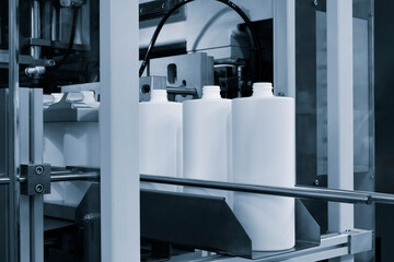 Poster - pharmaceutical industry, medicine pills are filling in the  bottle on production line machine conveyor at the medical factory. selective focus.