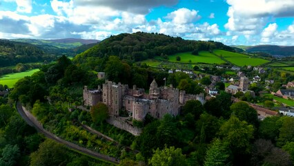 Wall Mural - Aerial view of Dunster Castle in the village of Dunster, Somerset, England, UK