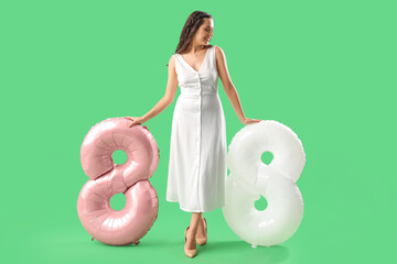 Poster - Beautiful woman with balloons in shape of figure 8 on green background. International Women's Day