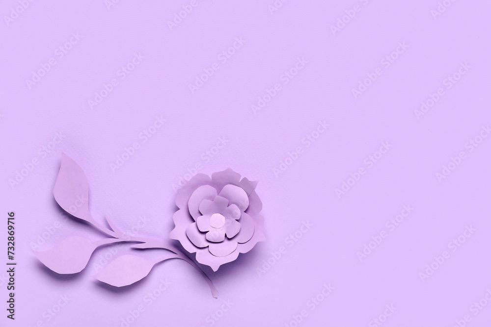 Beautiful origami flower with leaves on purple background