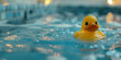 close-up of a rubber ducky in a bathtub with blue water