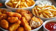 A close-up view of crispy fried fish and golden french fries served with tartar and ketchup sauces.