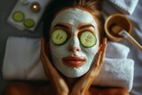 Fototapeta  - close-up of a woman lay down on a bed at a spa, applying a  facial mask, sliced cucumber on her eyes, captures the serene and rejuvenate