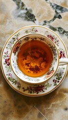 a cup of tea is sitting on a saucer