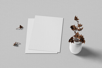 A4 blank paper sheet and dried flowers mockup template for your design - grey background, 3D rendering